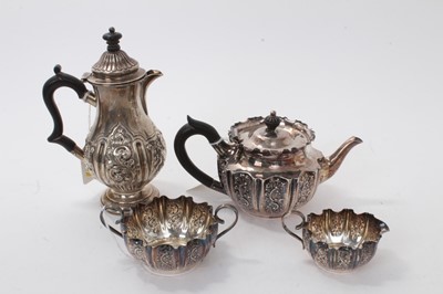 Lot 576 - Victorian silver batchelors' three piece tea set with repoussé floral scroll decoration ( Sheffield 1896) and similar small coffee/hot water pot ( London 1897) 20ozs all at (4)