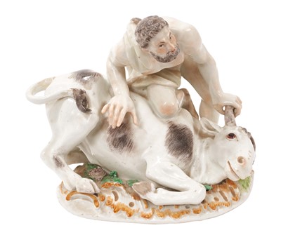 Lot 325 - A Meissen group of Hercules and the Caledonian bull, polychrome decorated, modelled after Kaendler and probably dating from the late 18th century, crossed swords mark, 15cm high x 17cm wide