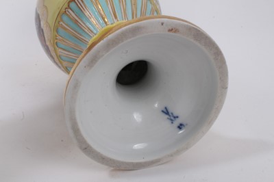 Lot 328 - A Meissen yellow ground vase, late 19th/early 20th century, polychrome decorated with a battle scene on one side and another narrative scene verso, with gilt and blue decoration, gilt snake handles...