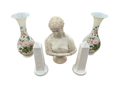 Lot 332 - A 19th century Parian ware bust of a woman, on a socle base, 31cm high, together with a pair of Victorian milk glass obelisks and a pair of enamelled opaque glass vases (5)