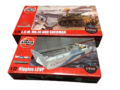 Lot 291 - Airfix D -Day 1:76 Scale LCM MkII & Sherman No.AO3301 (x5), 1:72 Scale Higgins LCVP No.AO2340 (x6) and Supermarine Spitfire Mk.1a with metal tin of sweets (13 total)