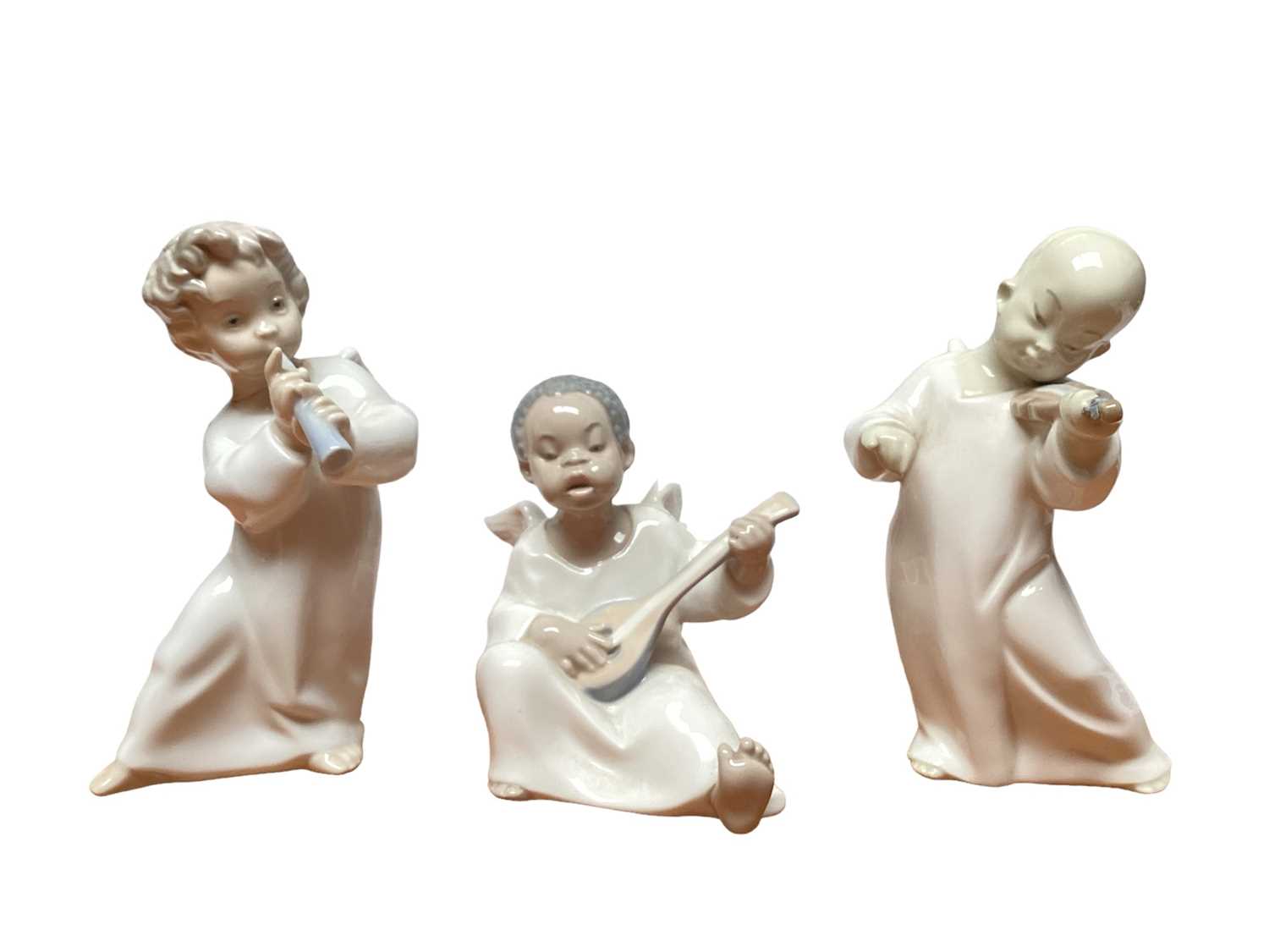 Lot 1156 - Six small Lladro porcelain angels, some playing musical instruments