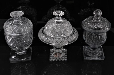 Lot 59 - Group of three 19th century cut glass sweetmeat urns and covers, of varying shapes, 18cm to 18.5cm high