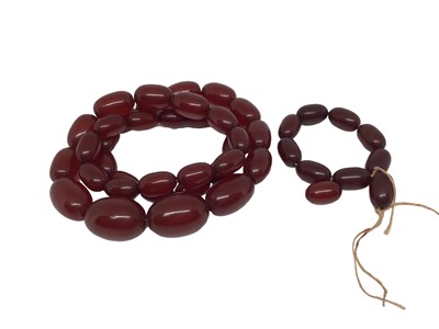 Lot 43 - 1920s simulated cherry amber graduated bead necklace