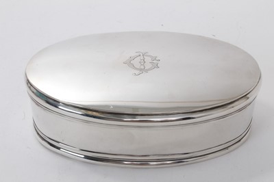 Lot 607 - George V silver dressing table box of oval form with engraved initials to hinged lid, opening to reveal a velvet lined interior, (London 1911), maker William Comyns, 17cm in length.