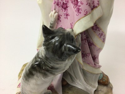 Lot 348 - Large Meissen figure of a lady and her cat, the lady modelled in Renaissance costume on naturalistic plinth base, blue crossed swords, pressnumber 63, 41cm high