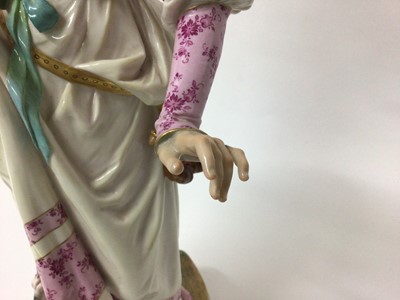 Lot 348 - Large Meissen figure of a lady and her cat, the lady modelled in Renaissance costume on naturalistic plinth base, blue crossed swords, pressnumber 63, 41cm high