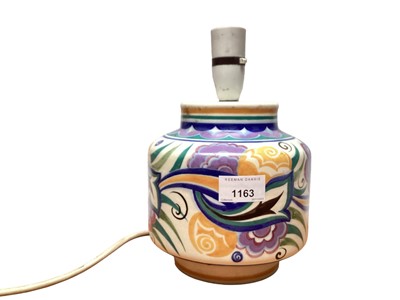 Lot 1163 - Poole pottery table lamp with polychrome painted floral decoration, 17cm high excluding fitting, together with a small vase and two preserve pots (4)