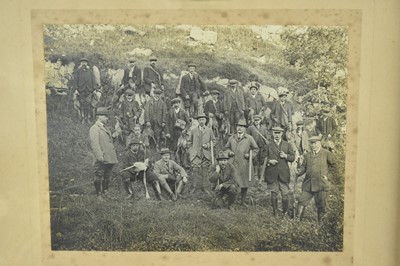 Lot 1262 - Edwardian black and white photograph depicting a pheasant shoot, the guns and beaters on a rocky bank, in orignal oak frame, 42cm x 51cm, another framed photograph of three chaps with two terriers...