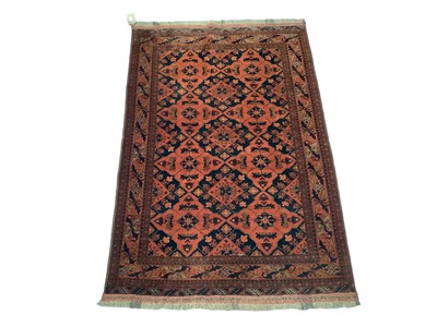 Lot 1717 - Afghan rug, with geometric foliate ornament on claret ground, 200 x 131cm