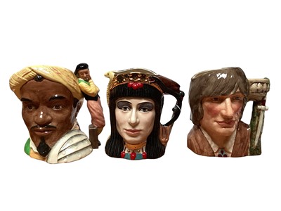 Lot 1168 - Three Royal Doulton character jugs - Anthony & Cleopatra D6728, Othello D6673 and Romeo DD6670, together with Falstaff figure HN2054 and a Toby jug (5)