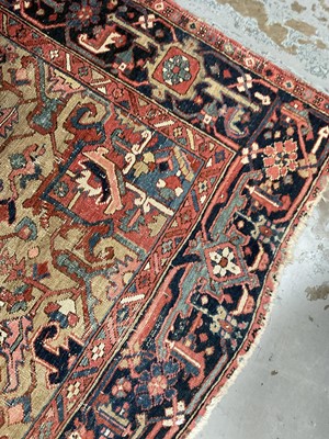 Lot 1722 - Large Heriz rug, with typical angular vibe ornament on brick red ground, in conforming borders, 320 x 245cm