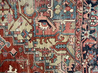 Lot 1722 - Large Heriz rug, with typical angular vibe ornament on brick red ground, in conforming borders, 320 x 245cm