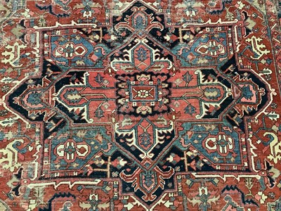 Lot 1722 - Large Heriz rug, with typical angular vibe ornament on brick red ground, in conforming borders, 320 x 245cm