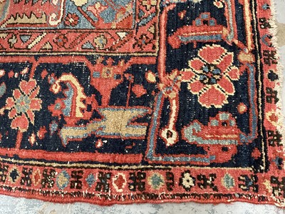 Lot 1722 - Large Heriz rug, with typical angular vibe ornament on brick red ground, in conforming borders, 320 x 245cm