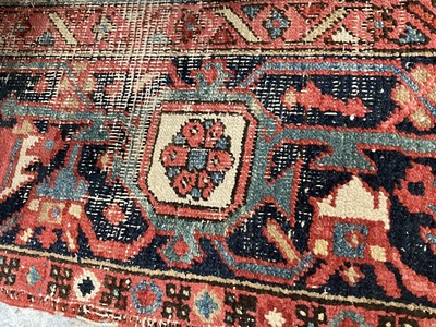 Lot 1722 - Large Heriz rug, with typical angular vibe ornament on brick red ground, in conforming borders, 320 x 245cm