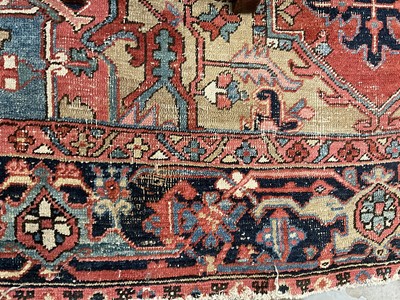 Lot 1722 - Large Heriz rug, with typical angular vibe ornament on brick red ground, in conforming borders, 320 x 245cm