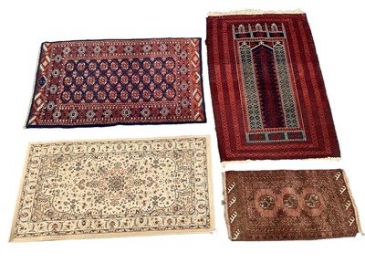 Lot 1723 - Belouche prayer rug, geometric ornament on claret ground, 156 x 103cm, and three further small modern rugs