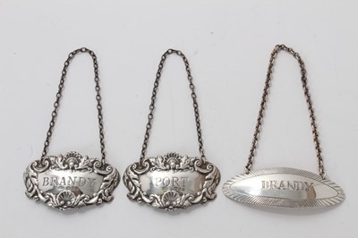 Lot 616 - Pair contemporary silver decanter labels of oval form with shell and scroll borders "Port" and "Brandy" (London 1969) maker AP together with one other "Brandy" (Birmingham 1968). (3)