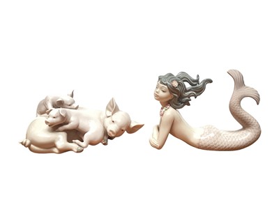 Lot 1181 - Four Lladro porcelain models - Mermaid, Pig family, Bear and a pair of Doves