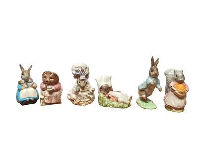 Lot 1182 - Six Royal Albert Beatrix Potter figures - Peter Rabbit, Goody Tiptoes, Lady Mouse, Mrs Tiggy Winkle Takes Tea, Benjamin Wakes Up and Mrs Rabbit & Bunnies, together with a Beswick Kitty MacBride fig...