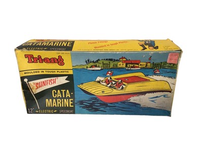 Lot 348 - Triang 12" Sunfish Catamarine electric speedboat, boxed No.512S & vintage Battery Operated Fire Tricycle, both boxes poor (2)