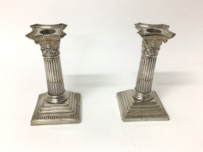 Lot 106 - Pair of late Victorian silver Corinthian column candlesticks, London 1900, William Hutton & Sons