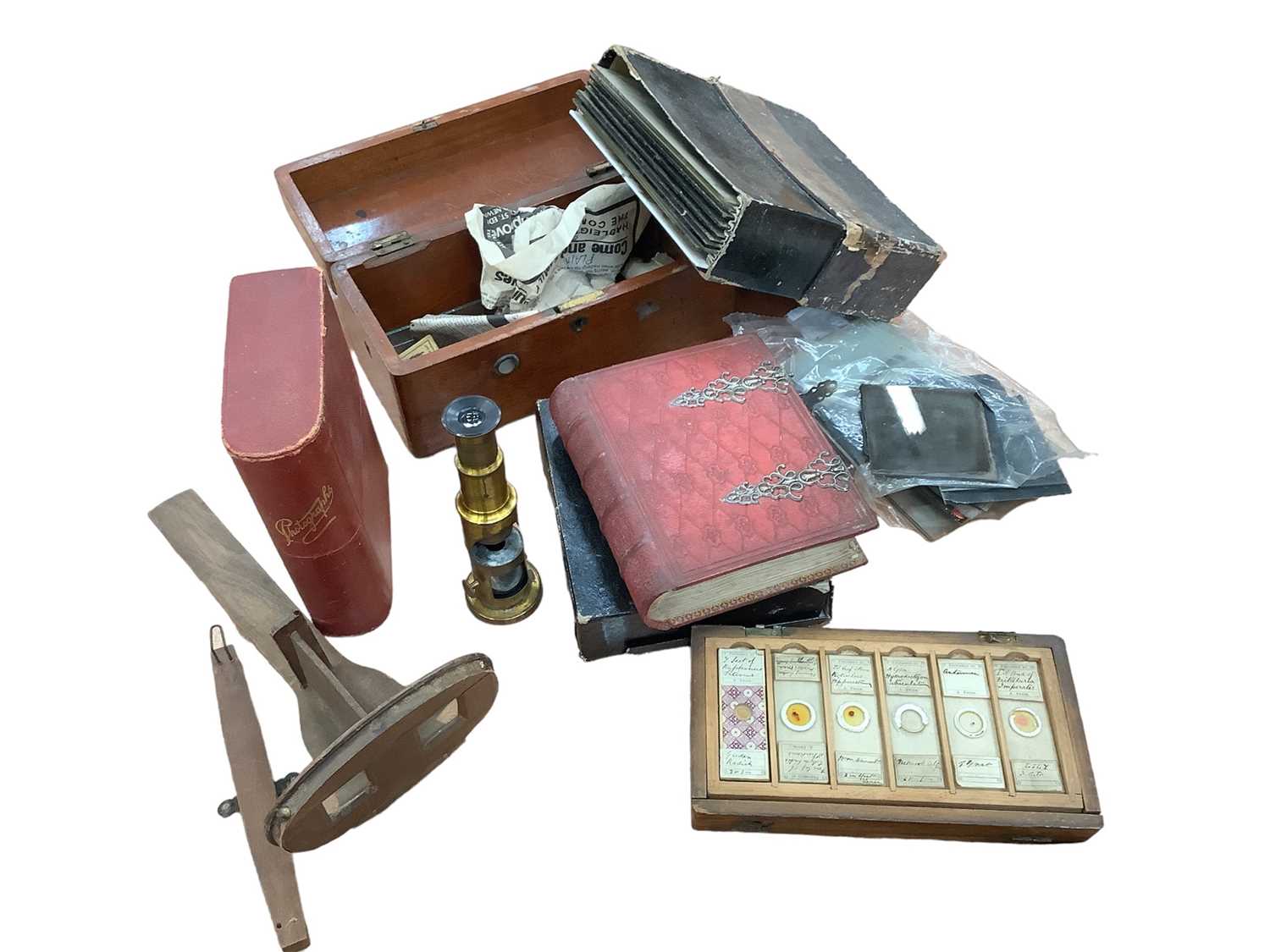 Lot 2658 - Antique brass student's microscope, stereoscopic viewer and slides, group of antique microscope slides, etc