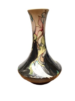 Lot 1193 - Moorcroft pottery vase decorated with birds and foliage on cream and black ground, signed Emma Bossons, dated 14.11.09, 28.5cm high