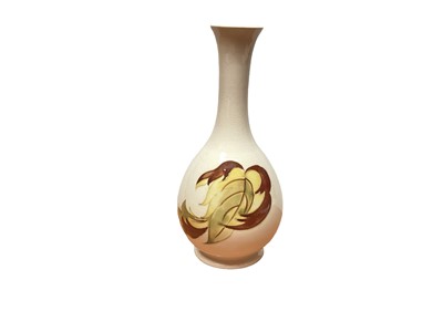 Lot 1197 - Moorcroft pottery vase decorated with autumn leaves on cream ground, 21.5cm high, together with a framed and glazed picture of a Moorcroft Spring Festival pattern vase, 23cm x 23cm (2)