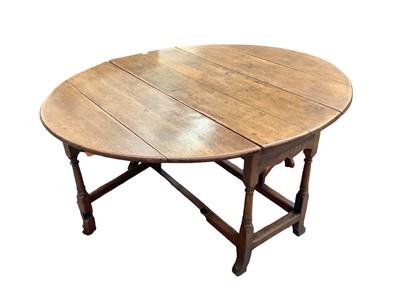 Lot 1696 - 18th century oak gateleg table on turned and shaped supports joined by stretchers