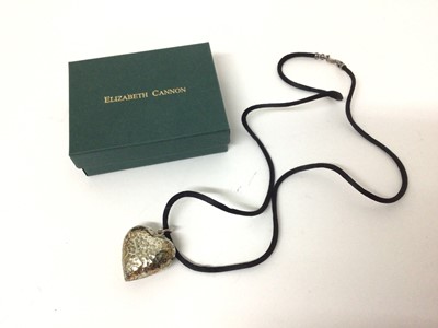 Lot 108 - Contemporary silver heart shaped pendant with hammered finish, from Elizabeth Cannon, boxed