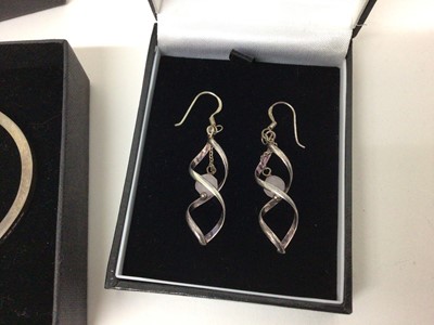 Lot 109 - Contemporary silver bangle of plain form, together with a pair of modern silver earrings