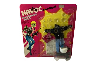Lot 373 - Model Toys Limited The Amazing Havoc Super Agent 9 1/2" action figure, in window box No.75001 & Race Against Death outfit, on card & blister pack (2)