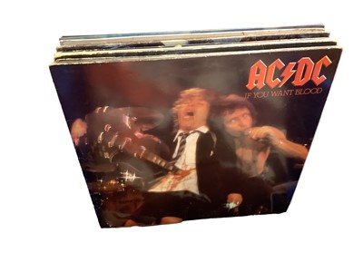 Lot 2211 - Two boxes of LP records, including Saxon, U2, AC/DC, Rainbow, Pretenders, UFO, Moody Blue, Ramones, Stranglers, Scorpions, Dire Straits and Ian Dury - some 12" singles included, conditions vary