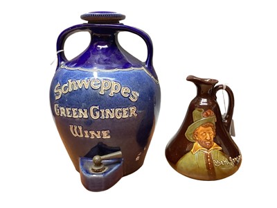 Lot 1199 - Early 20th century Schweppes Green Ginger Wine advertising flagon together with a Royal Doulton Dewar's Whisky 'Ben Jonson' flagon (2)