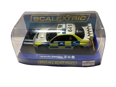 Lot 1910 - Scalextric 2006 Subaru Impreza Police Car C3068, Morris Mini Police Car C3213, Bob Holden Mini No.13 C3302, 1963 VW Beetle C3204, VW Camper Van Type 1b C3395 & VW Panel Van Type 1b C3645, all in Pe...