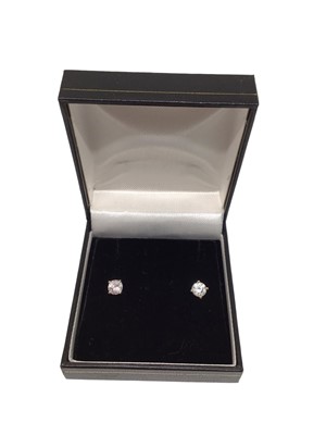 Lot 139 - Pair of diamond single stone stud earrings, each with a round brilliant cut diamond (probably fracture filled) in four-claw 18ct white gold setting. Estimated total diamond weight approximately 0.9...