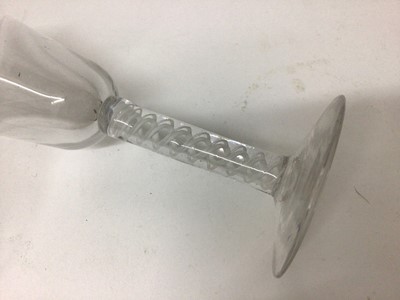 Lot 27 - A Georgian multi-spiral air twist stem wine glass, together with a plain stem wine glass and a Continental opaque twist stem wine glass (3)