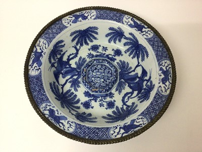 Lot 140 - 18th century blue and white delftware bowl painted in the Chinese style, with fluted brass rim