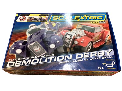 Lot 1933 - Scalextric 1:32 Scale Quick Build Demolition Derby with Metal Alien v White Skull, box sealed (torn near handle) (1)