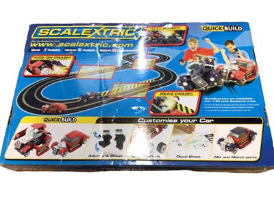 Lot 1933 - Scalextric 1:32 Scale Quick Build Demolition Derby with Metal Alien v White Skull, box sealed (torn near handle) (1)