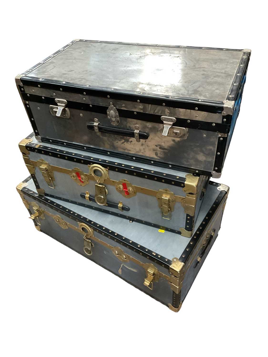 Lot 1266 - Three metal travelling trunks