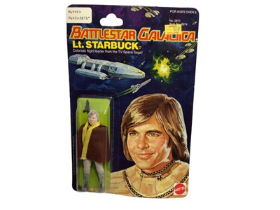 Lot 406 - Mattel 1978 Battlestar Galactica Lt Starbucks 4" action figure with colonial blaster & cloth cape, on Series 1 punched card and blister pack No.2874 (1)