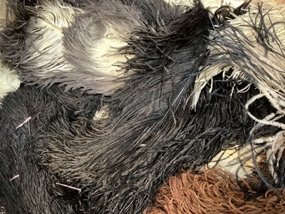 Lot 2114 - Quantity of ostrich feathers including pink and black, white and cream single feathers.  Also a selection of milliners bird feathers and plumes