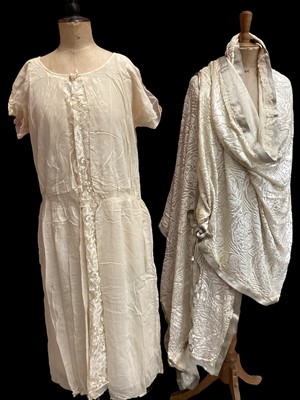 Lot 2118 - 1920's cream chiffon and lace wedding dress with kitten heel cream satin wedding shoes, long cream devore velvet wrap trimmed with silver metallic ribbon.  Also long cream leather  gloves.  All in...