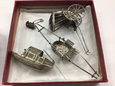 Lot 1001 - Chinese silver/white metal rickshaws, rowing boat etc, three silver napkin rings, plated ware and a bedside clock