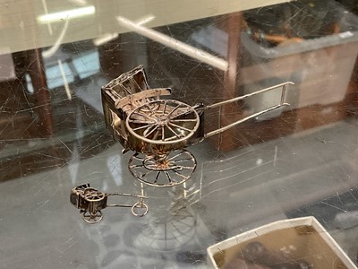 Lot 1001 - Chinese silver/white metal rickshaws, rowing boat etc, three silver napkin rings, plated ware and a bedside clock