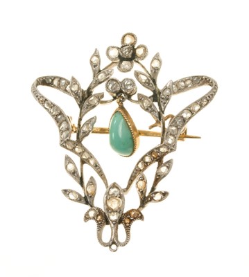 Lot 597 - Edwardian diamond set floral scroll brooch with a pear shaped turquoise cabochon suspended in the open work centre