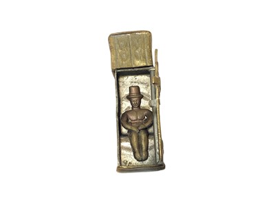 Lot 5 - Victorian brass novelty Vesta case in the form of an outside privy with opening door revealing seated figure 50mm high and another in the form of a brass violin case (2)